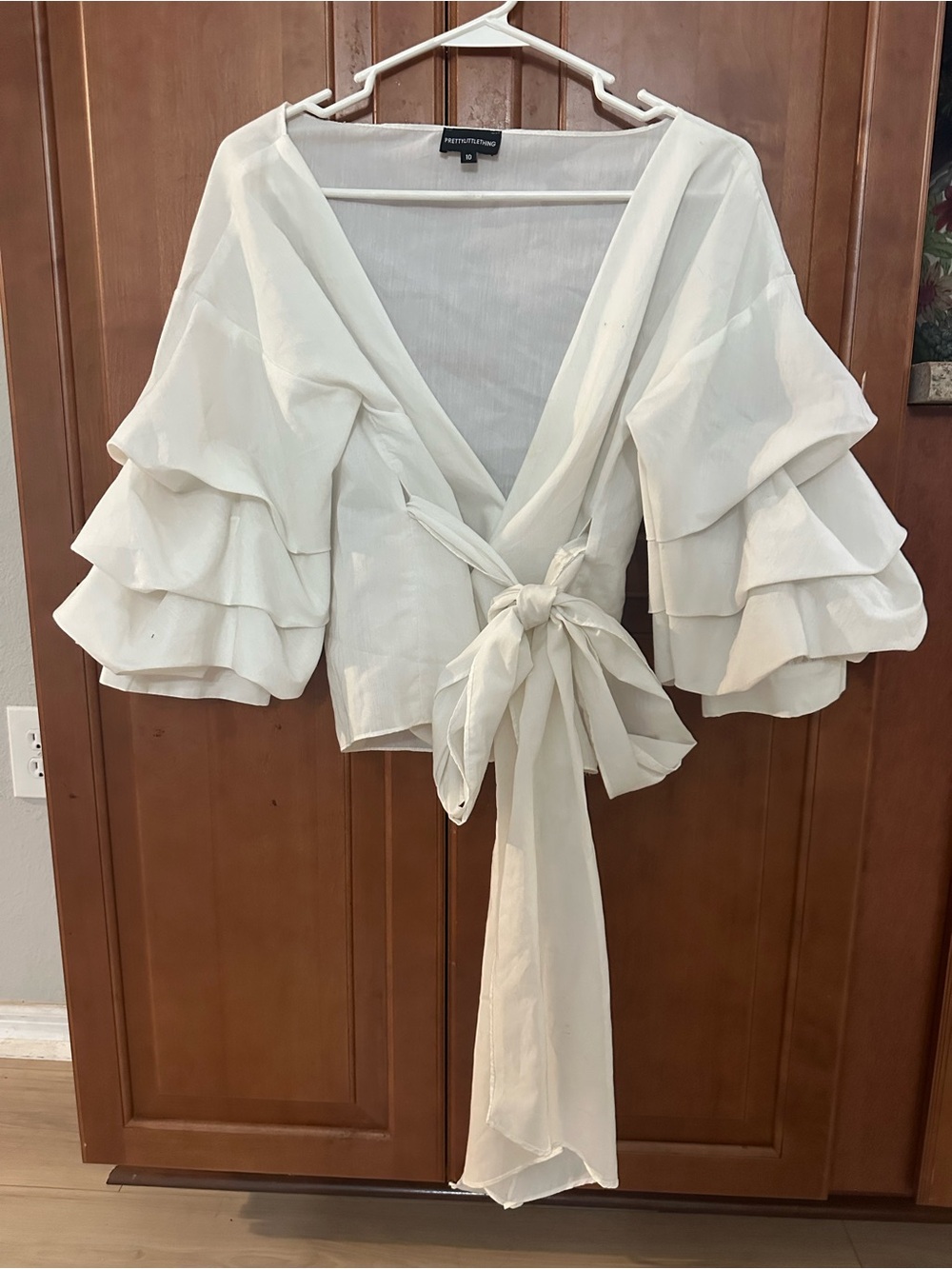 PrettyLittleThing Ivory Tie-Front Ruffle Sleeve Wrap Top